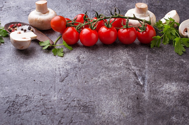 Cherry tomatoes and mushrooms. Top view