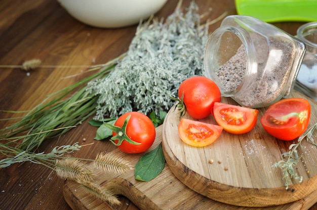 Cherry tomatoes on a rustic old wooden table