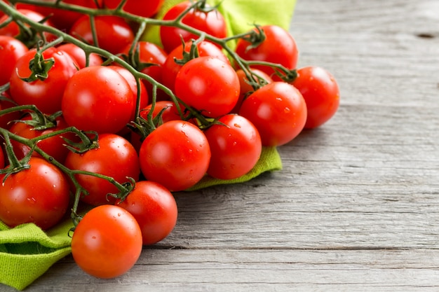 Cherry tomatoes on wood background