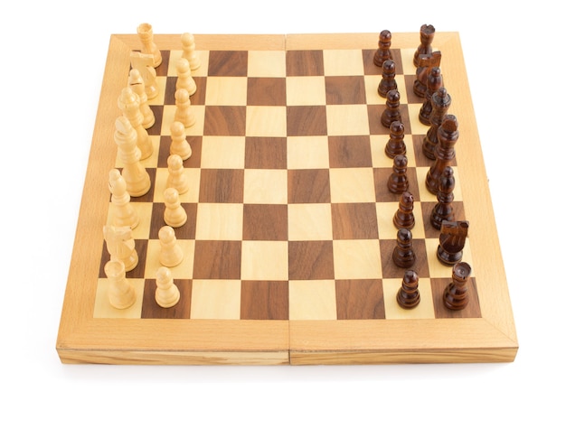 Chess figures on board isolated at white background