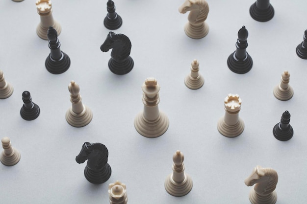 Chess game pieces on a grey background Strategy concept