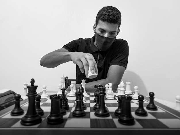 chess player thinking about the next move portrait of man playing chess in black and white chess