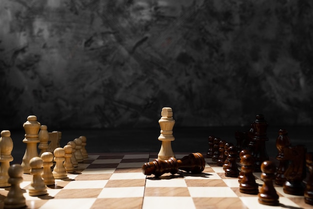 Chess set on the chess board business concept with blur image background