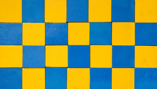 Chessboard with ukraine flag colors conflict europe and russia war concept wooden blocks