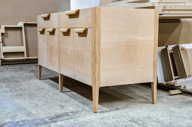 Chest of drawers made of solid alder in process of production at workshop