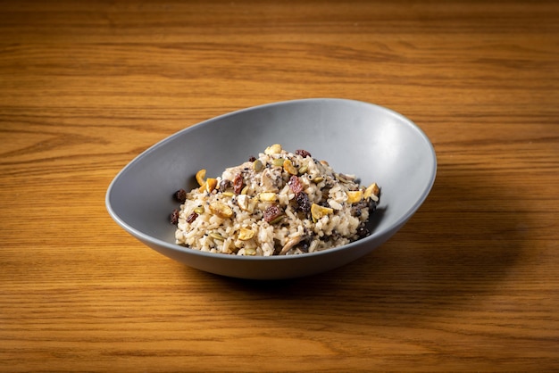 Chestnut Mushroom Risotto served in dish isolated on table top view of thai food