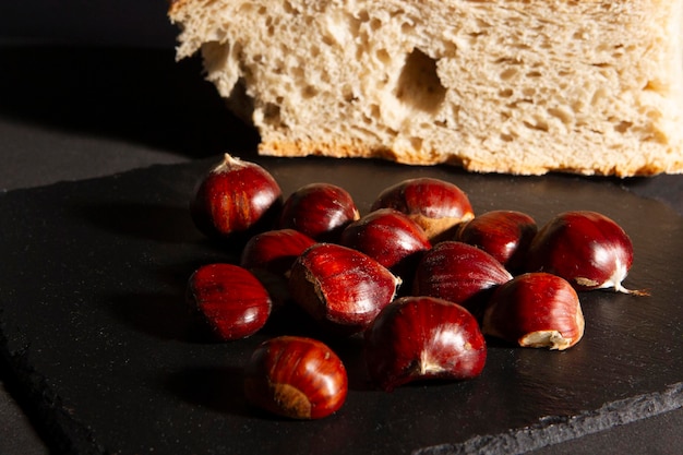 chestnuts on slate plate with traditional breadcrumb background