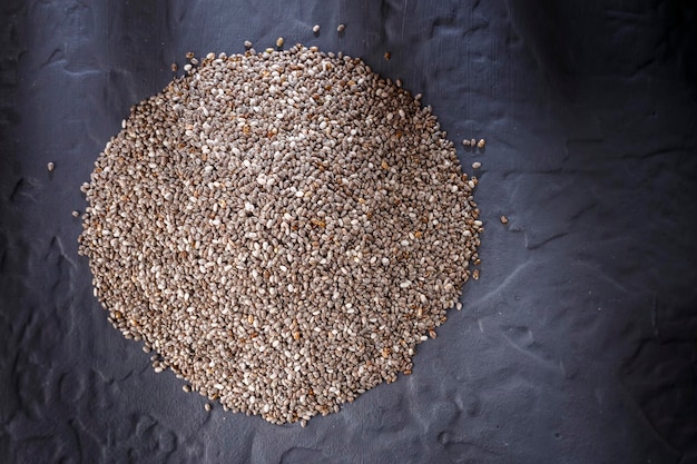 Chia seeds on black background