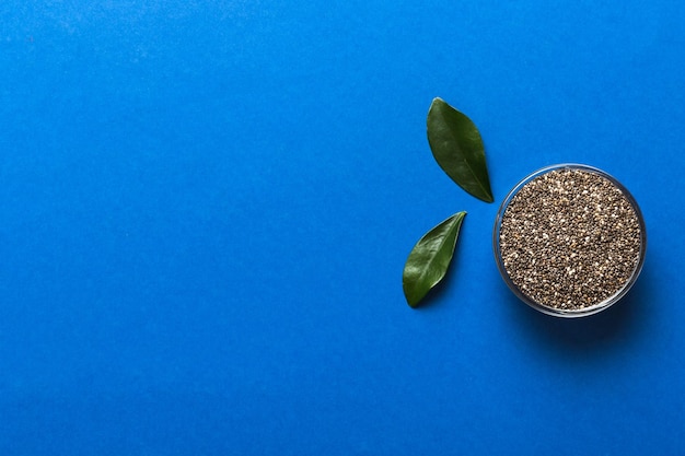 Chia seeds in bowl on colored background Healthy Salvia hispanica in small bowl Healthy superfood