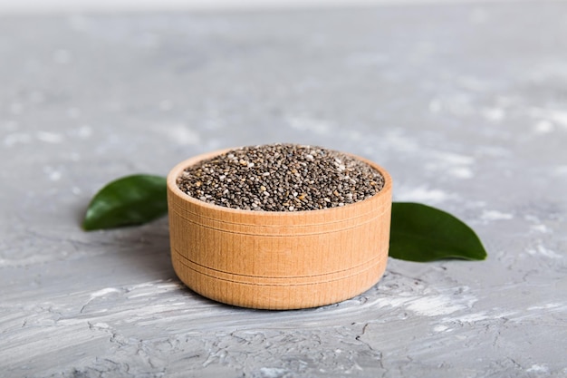 Chia seeds in bowl on colored background Healthy Salvia hispanica in small bowl Healthy superfood