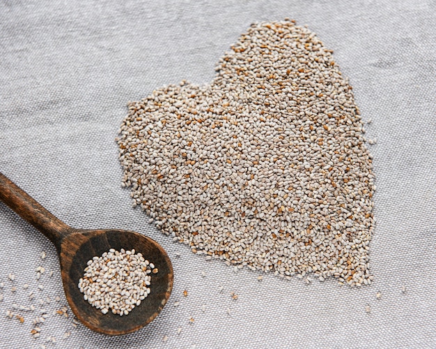 Chia seeds on a grey textile table.