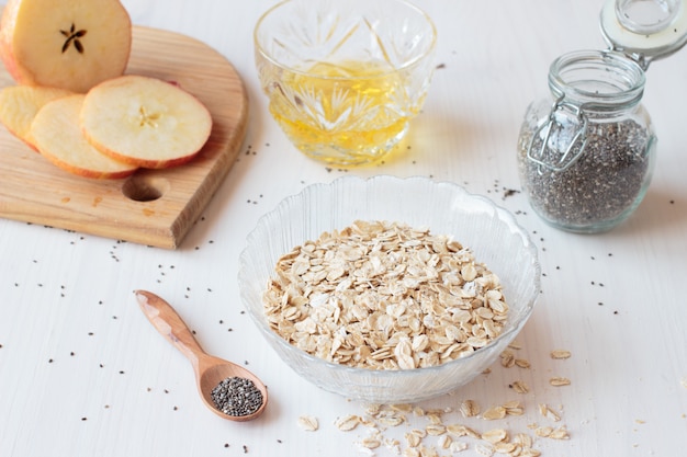 Chia seeds, oatmeal cereals and apple for breakfast