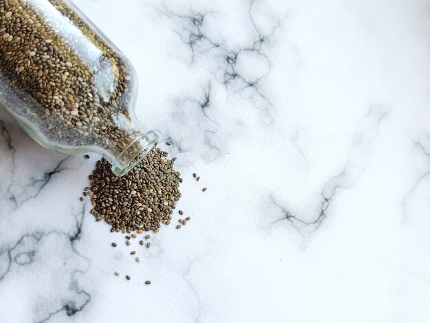 chia seeds sprinkled on a white background porridge for a healthy diet