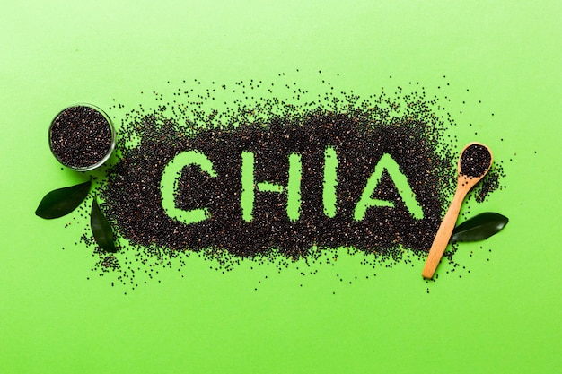 Chia word made from chia seeds top view on colored background Healthy superfood