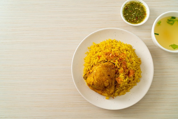 Chicken Biryani or Curried rice and chicken ThaiMuslim version of Indian biryani with fragrant yellow rice and chicken