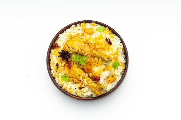 Chicken biryani made using jeera rice and spices arranged in a wooden tableware