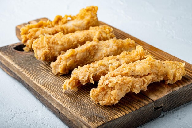 Chicken breaded breast fillet on white background.