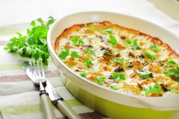 Chicken breast and cauliflower casserole in ceramic baking dish