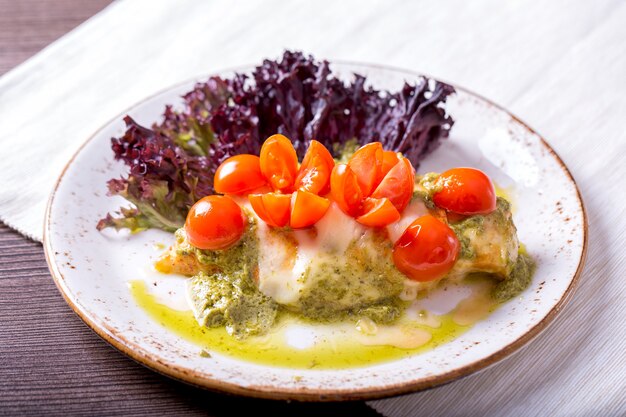 Chicken breast with tomatoes and pesto sauce