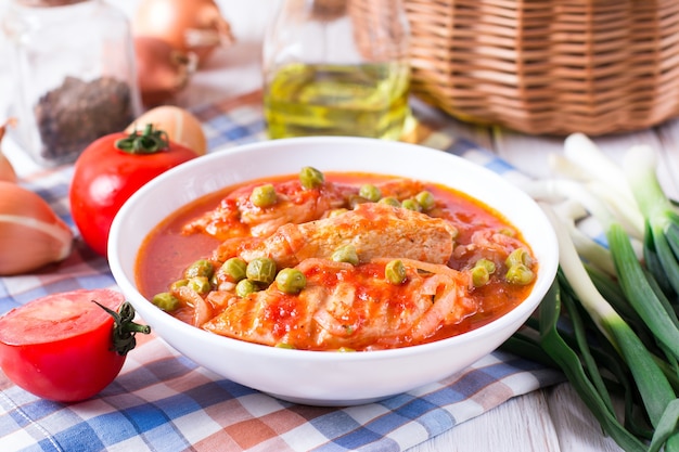 Chicken Cacciatore with braised chicken with tomatoes and green peas