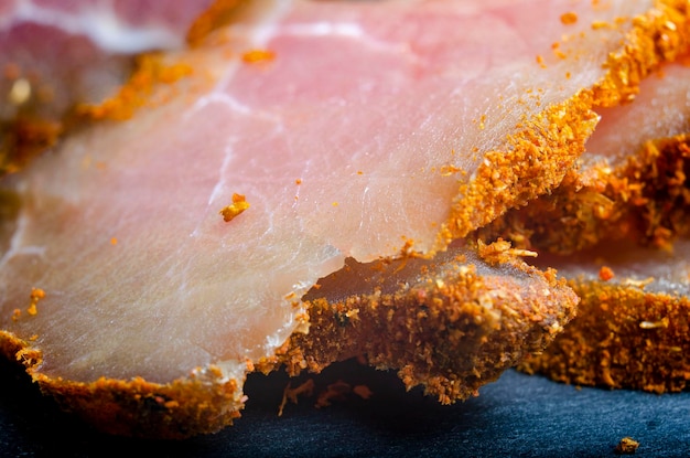 Chicken carpaccio close-up sliced with spice breading