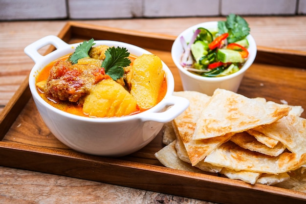 chicken curry bowl serves with  roti,