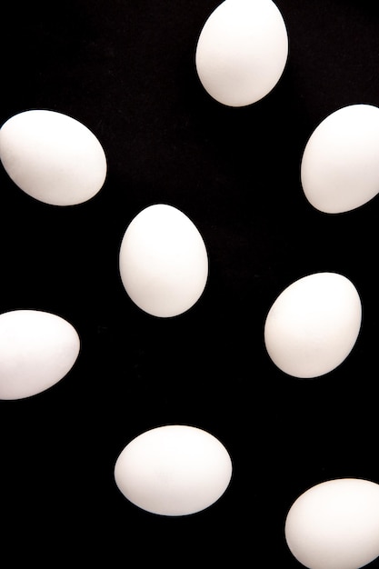 Chicken eggs on a black background