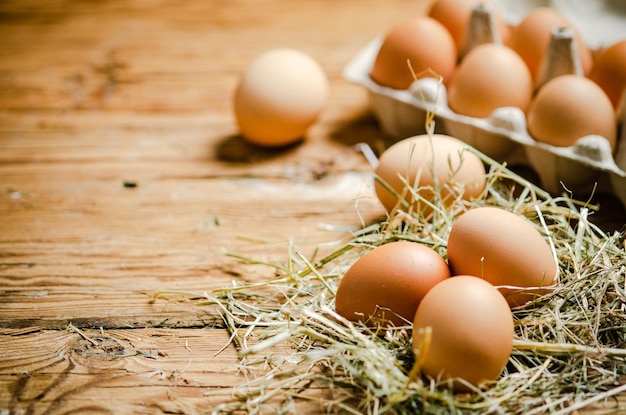 Chicken eggs on a wooden table