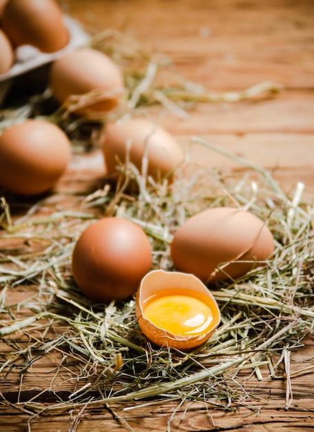 Chicken eggs on a wooden table