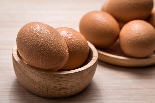 Chicken eggs on wooden table