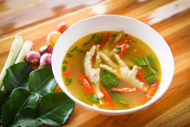 Chicken Feet Spicy Soup Chicken Foot with hot and sour soup bowl with fresh vegetables 