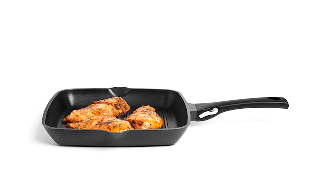 Chicken fillet on grill pan isolated