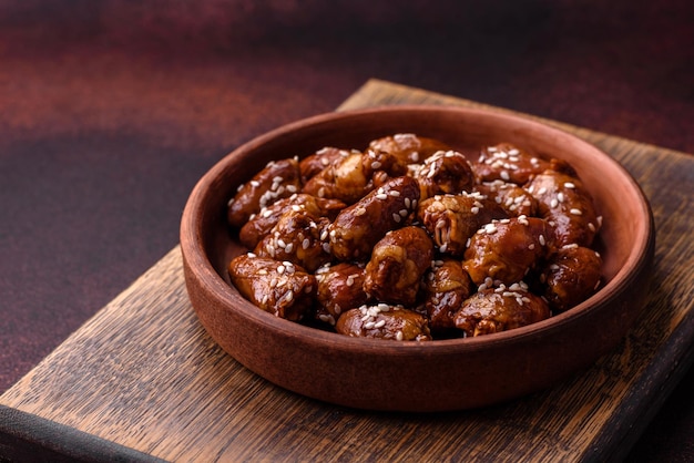 Chicken hearts fried in soy sauce with salt and spices in a plate