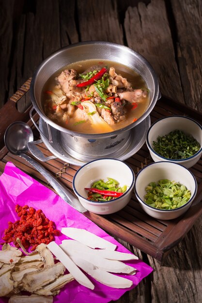 Chicken and herb soup in pot