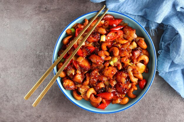 Chicken kung pao. Fried chicken pieces with cashew nuts and peppers.