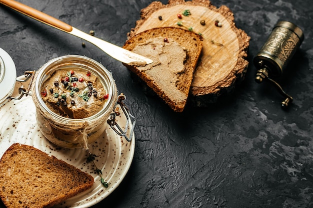 Chicken liver pate on dark background Chicken liver pate spread banner menu recipe place for text top view