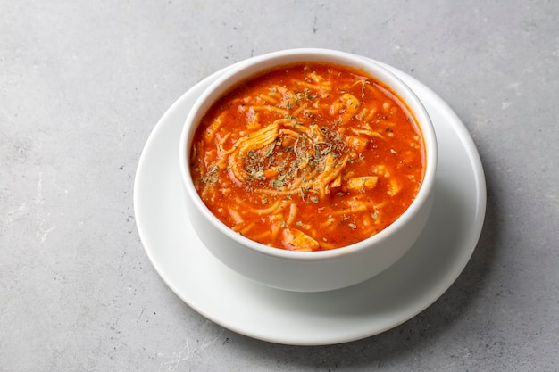 Chicken noodle soup with tomato. Turkish name; Domatesli tavuklu sehriye corbasi