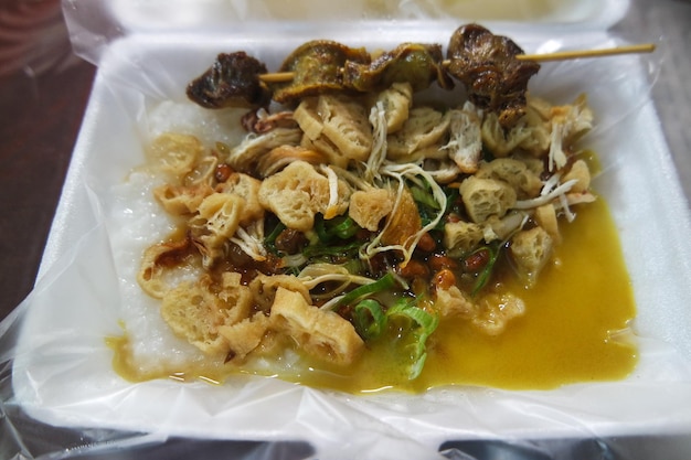 chicken porridge with soup in meal box