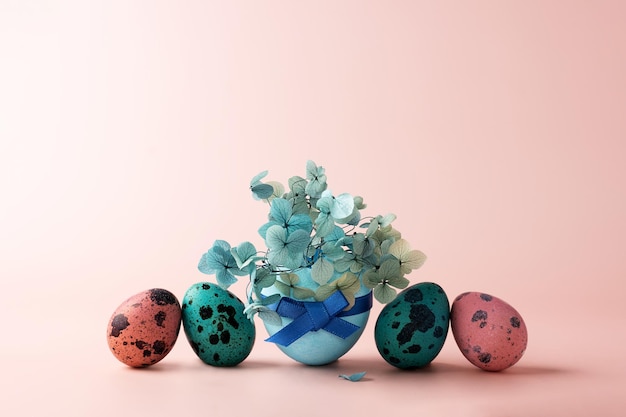 Chicken and quail pink blue Easter eggs with hydrangea