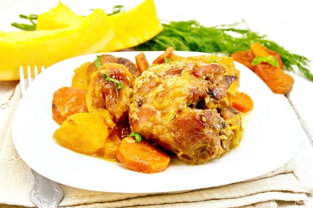 Chicken roast with pumpkin and dried apricots on board