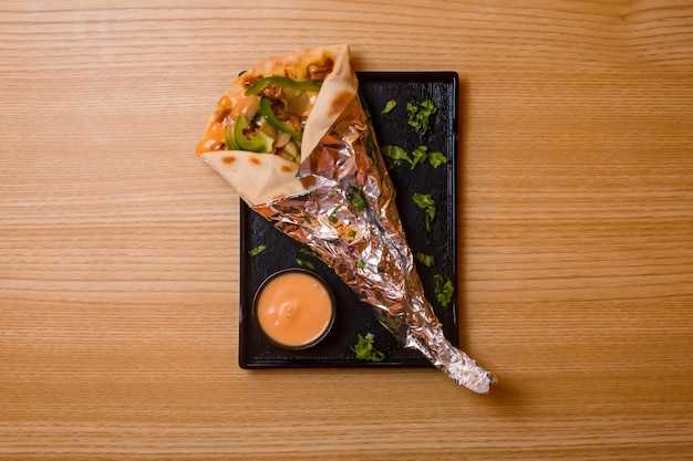 Chicken roll with dip served in dish isolated on table top view bangladeshi food