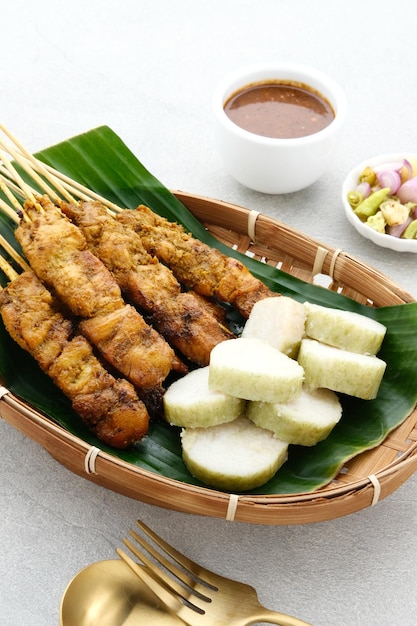 Chicken satay sate ayam sate martawi with Lontong and peanut sauce Selected focus