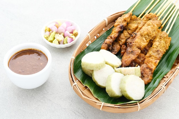 Chicken satay sate ayam sate martawi with Lontong and peanut sauce Selected focus