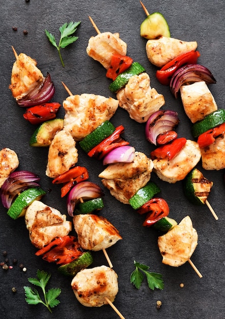 Chicken shashlik and vegetables peppers onions zucchini on skewers