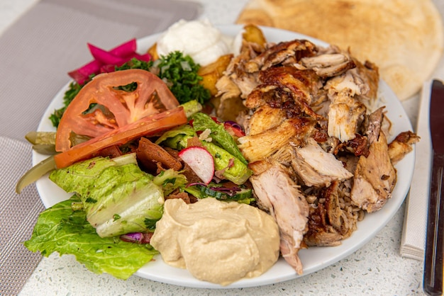 Chicken Shawarma Doner on a plate Chicken Shawarma plate isolated on white background