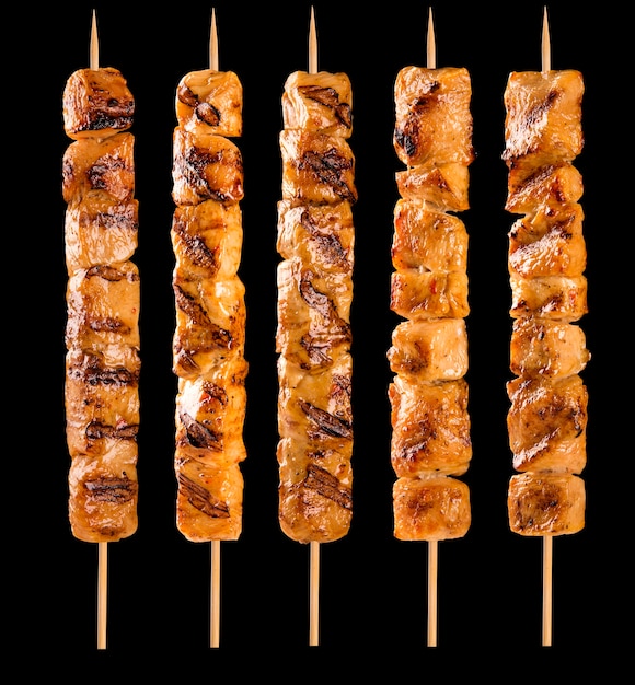 chicken skewer isolated on black