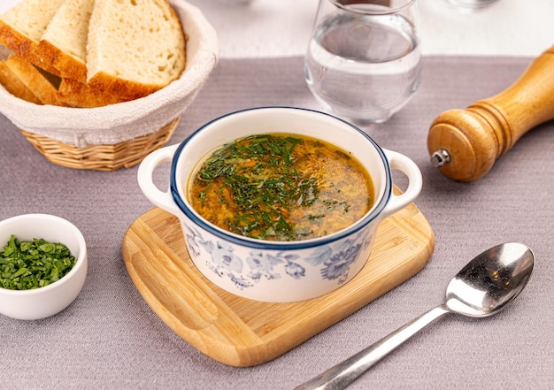 Chicken soup served with bread