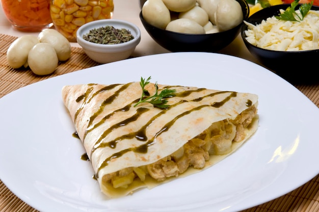 Chicken stroganoff crepe with igredients on background,