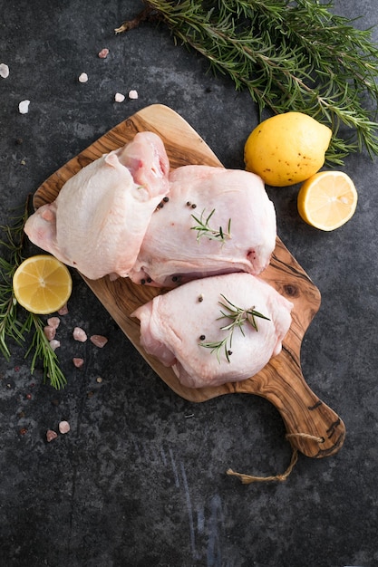 Chicken thighs with lemon fresh rosemary Copy space