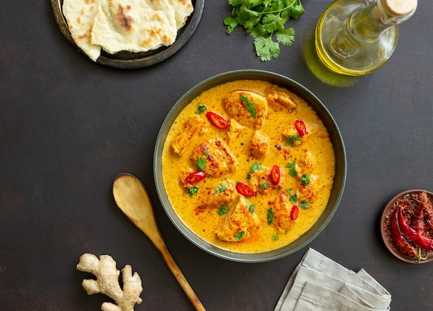 Chicken tikka masala curry with herbs and peppers. Indian food. National cuisine.